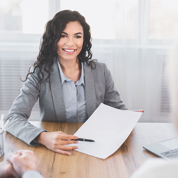 Tax accountant at Tax Purpose in Lilydale discussing client documents, offering expert tax return, BAS, and bookkeeping services.